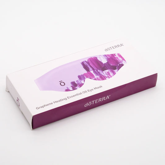 Boîte blanche et mauve du masque oculaire chauffant doTERRA aux huiles essentielles, avec visuel du masque sur le dessus.