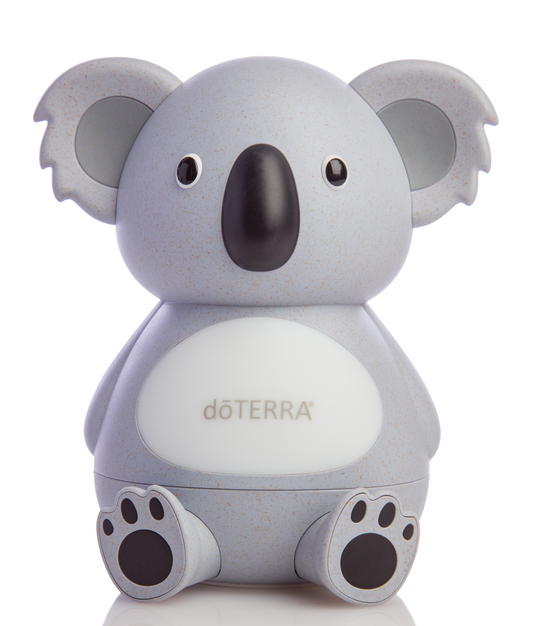 Diffuseur Koala de doTERRA en forme de koala blanc moucheté, vu de face, avec nez noir, grandes oreilles et pattes visibles.