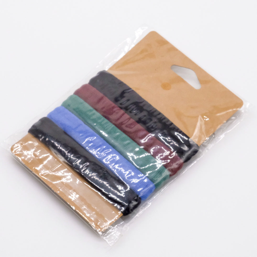 Lot de 5 élastiques à cheveux doTERRA multicolores dans un emballage transparent.
