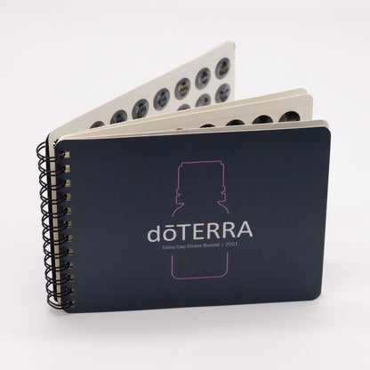 Livret de collants doTERRA pour bouchons d’huiles essentielles, avec reliure spirale et pages de pastilles visibles.