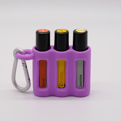 Porte-rouleaux à bille triple violet avec mousqueton, contenant trois rouleaux à bille doTERRA.