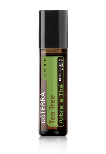 Rouleau à bille Tea Tree Touch doTERRA 10 ml, flacon ambré avec étiquette verte et bouchon noir.