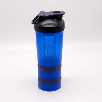 Shaker bleu doTERRA entièrement assemblé avec couvercle noir rabattable et deux compartiments vissables au bas.